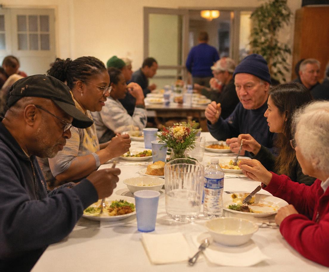 Neighbors sharing a hot meal together at a community hall